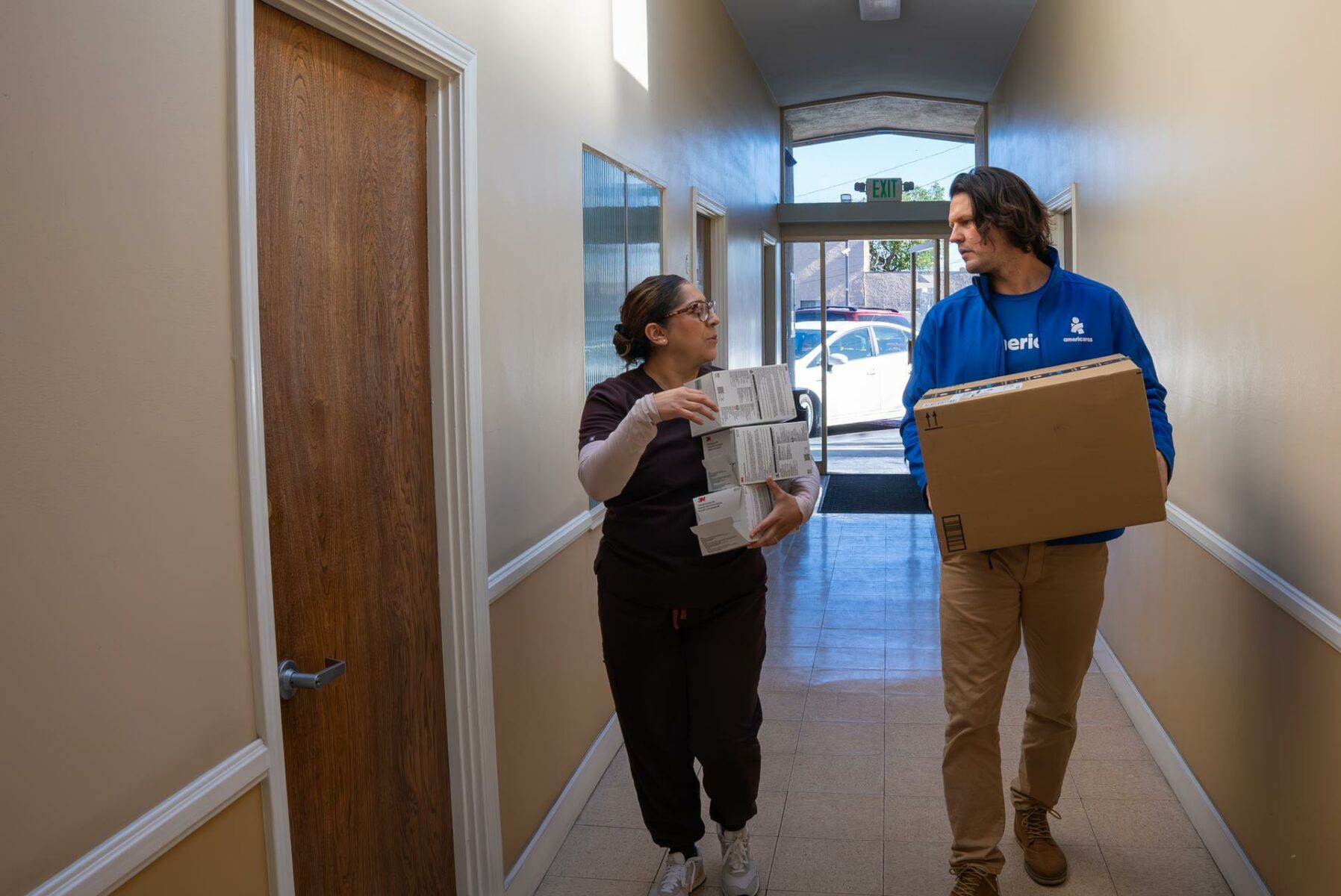 Jake Wheeler (right) delivers a package of 300 N95 masks to Karla Rugamas (left) of Vida Mobile Clinic on Tuesday, January 14, 2025 in Granada Hills, California (Photo/Mike Demas).

Wildfires fueled by dry conditions and strong Santa Ana winds erupted in the Los Angeles area early Monday, January 6, 2025, forcing thousands to evacuate and threatening homes and businesses.