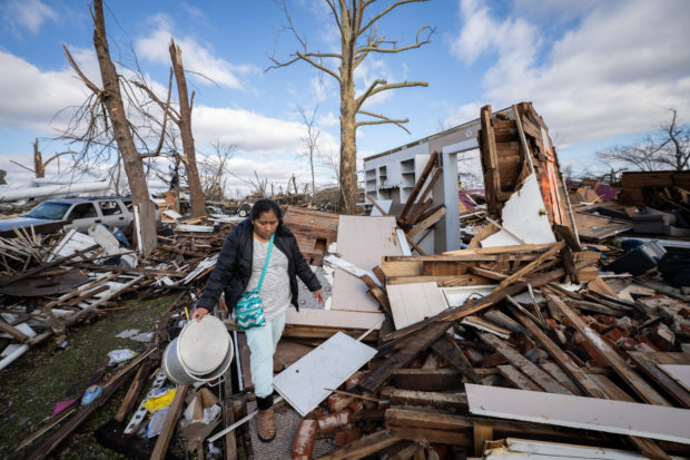 Hurricane Recovery - The Ramos family searches the rubble of their home